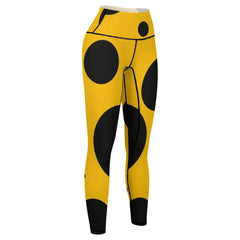 Black polka dots on yellow background Leggings