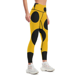 Black polka dots on yellow background Leggings