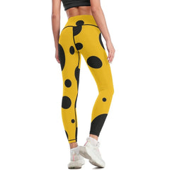 Black polka dots on yellow background Leggings