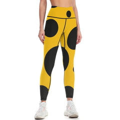 Black polka dots on yellow background Leggings