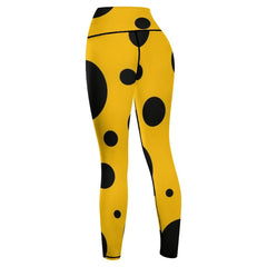 Black polka dots on yellow background Leggings